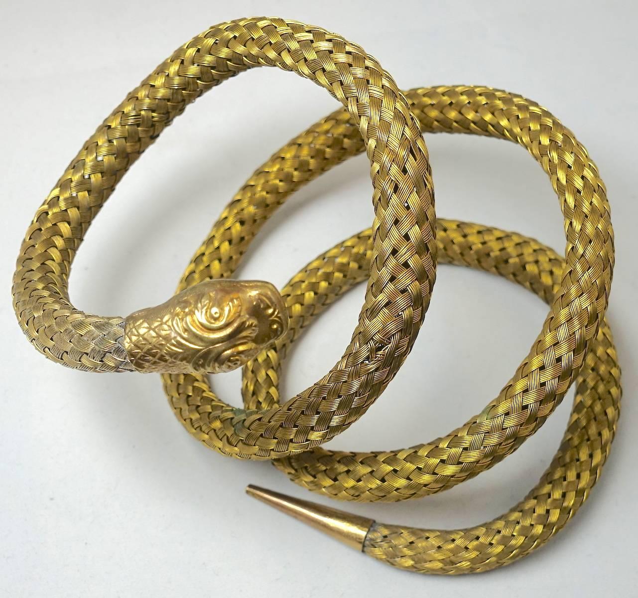 I love this serpent coil arm bracelet. It is made with a woven wire basket design. The head has great detail and life-like scales. This arm bracelet was made in a brass tone setting and measures 4-1/2” high and 1/2” wide. but it can be stretched to