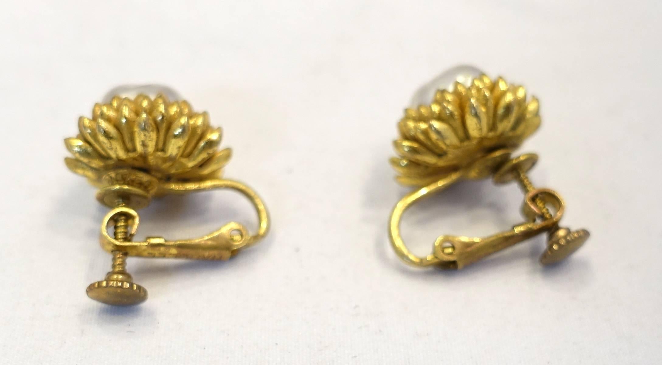Whenever I find these Haskell earrings, I must have them.  They are Haskell’s famous acorn earrings. These vintage signed Miriam Haskell earrings feature faux pearls in a gold-tone setting.  These clip earrings measure 5/8” across, are signed