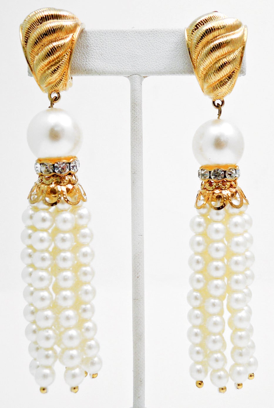 Vintage Givenchy prices have almost doubled since the New Year and I have been having a tough time finding splendid pieces.  These vintage signed Givenchy earrings feature faux pearls with clear rhinestone accents in a gold-tone setting.  These clip
