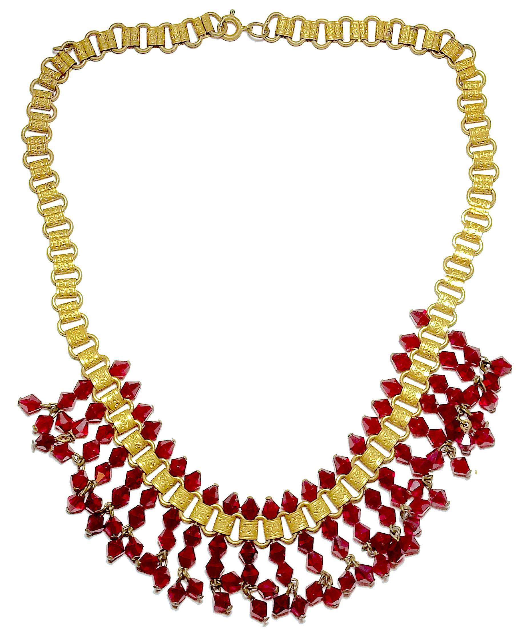 This necklace is designed with the old book chain necklace with old red Czech glass drops in the front.  This necklace is from the 1930s and made with a brass tone base metal.  It measures 16-1/2” long falls 1-1/4