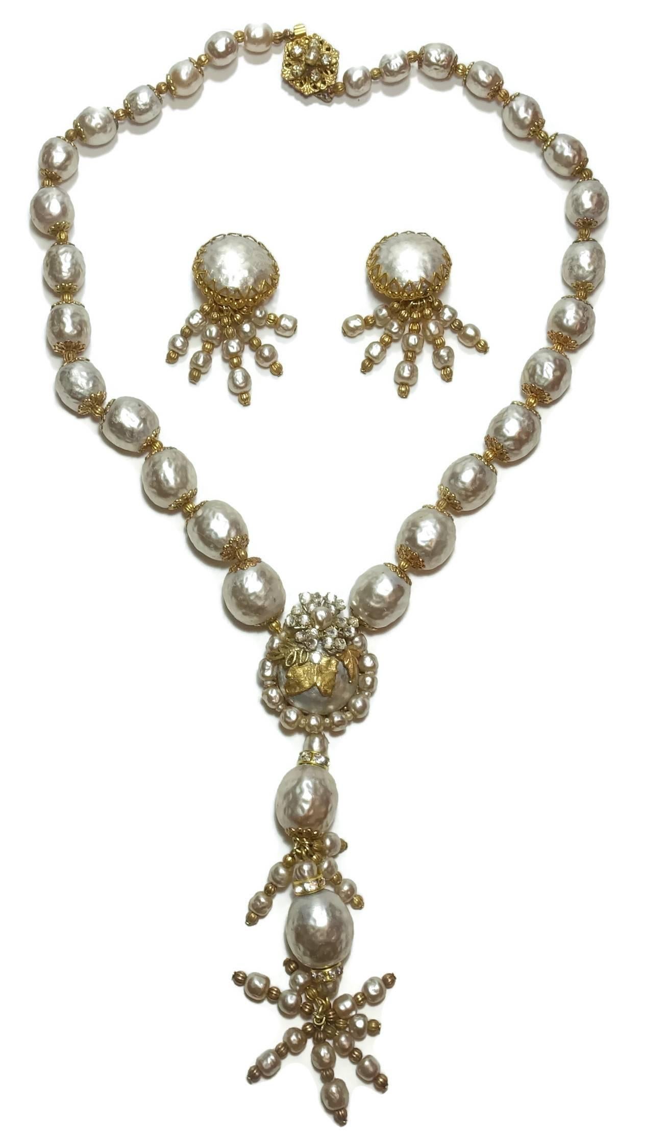 It’s not often I find such a beautiful Haskell set like this.  The necklace has graduated baroque faux pearls leading down to the main centerpiece drop.  The top of the centerpiece has rose montees surrounding a center pearl.  Gold tone leaves drop