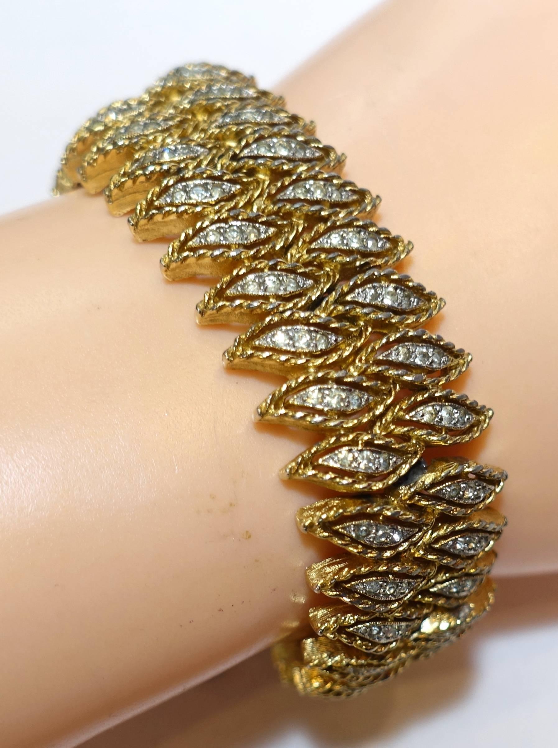 Panetta was known for their gorgeous jewelry and how it looked like real jewelry.  This vintage bracelet is no exception.  It has a double row of diamond shape teardrops with rhinestone centers.  It is made in a gold tone base metal with a slide in