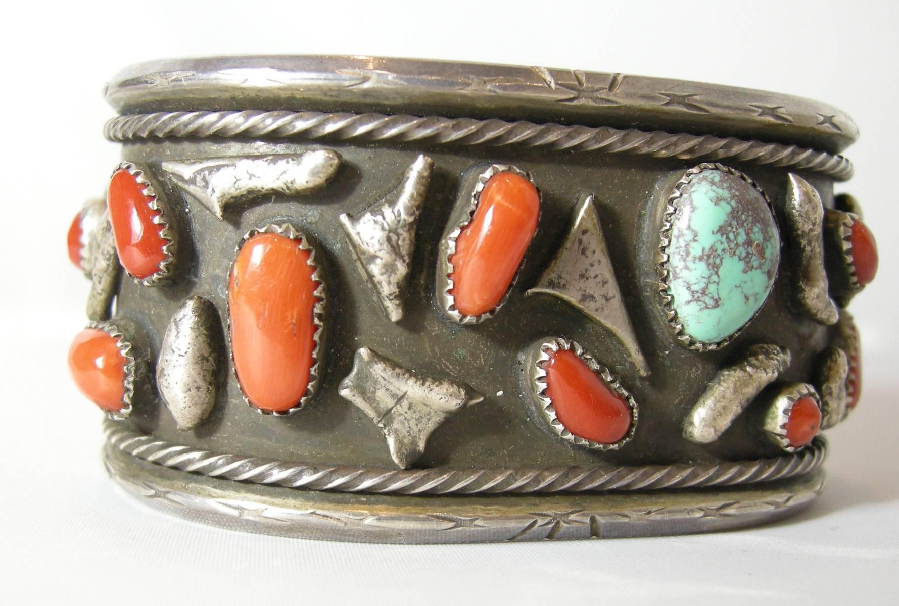 This is a wonderful Zuni Indian cuff with the design of combining coral and turquoise in various shapes.  Each stone is bezel with a sterling rim.  It is 1-1/2” high and 2-5/8” wide.  The inside measures 7-3/8”.  This cuff is in excellent condition.