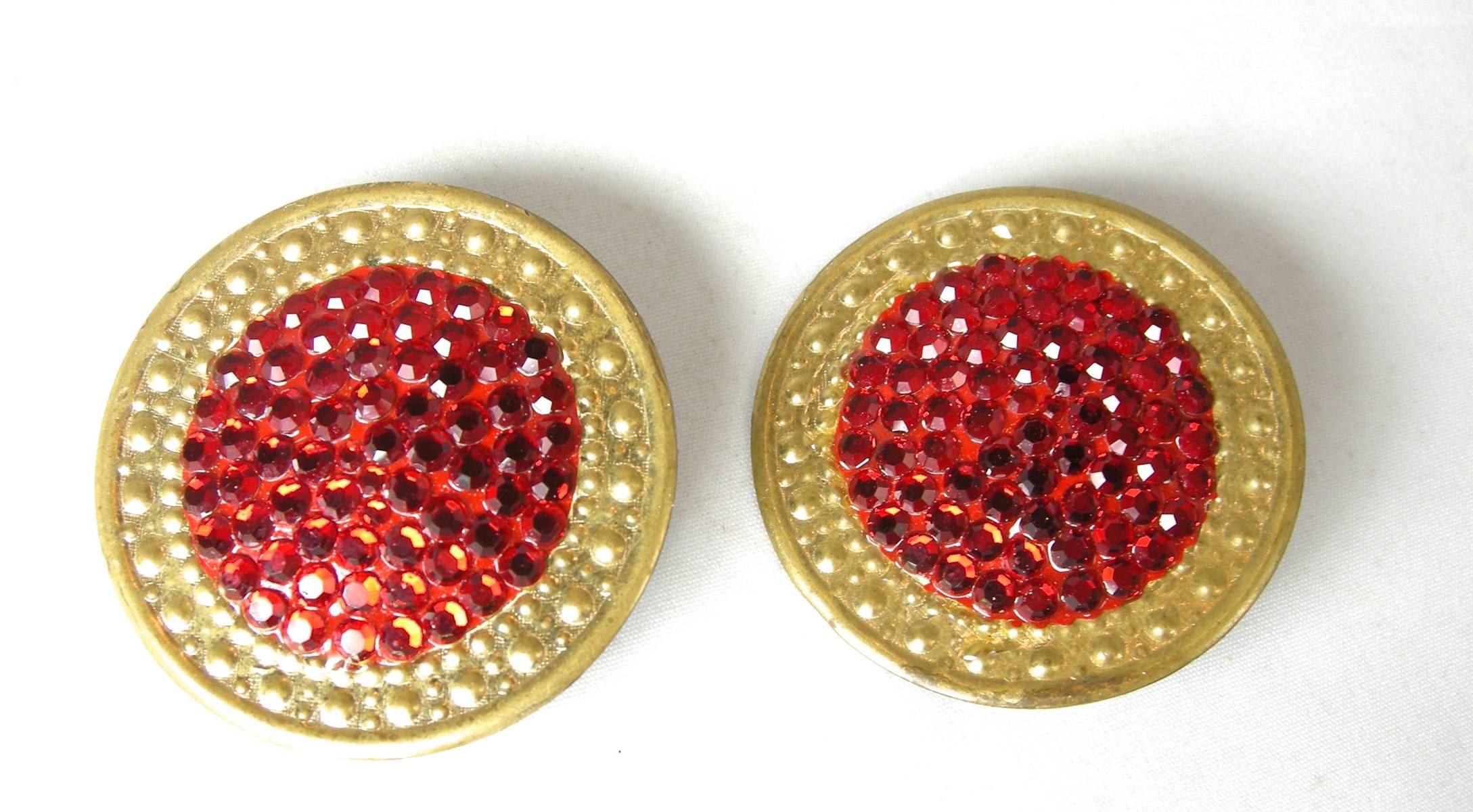 I love Richard Kerr’s jewelry, especially his earrings and this is no exception.  Actually these are perfect for the holidays.  These clip earrings are round with a gold tone design on the outside and the center is filled with vibrant red flat back