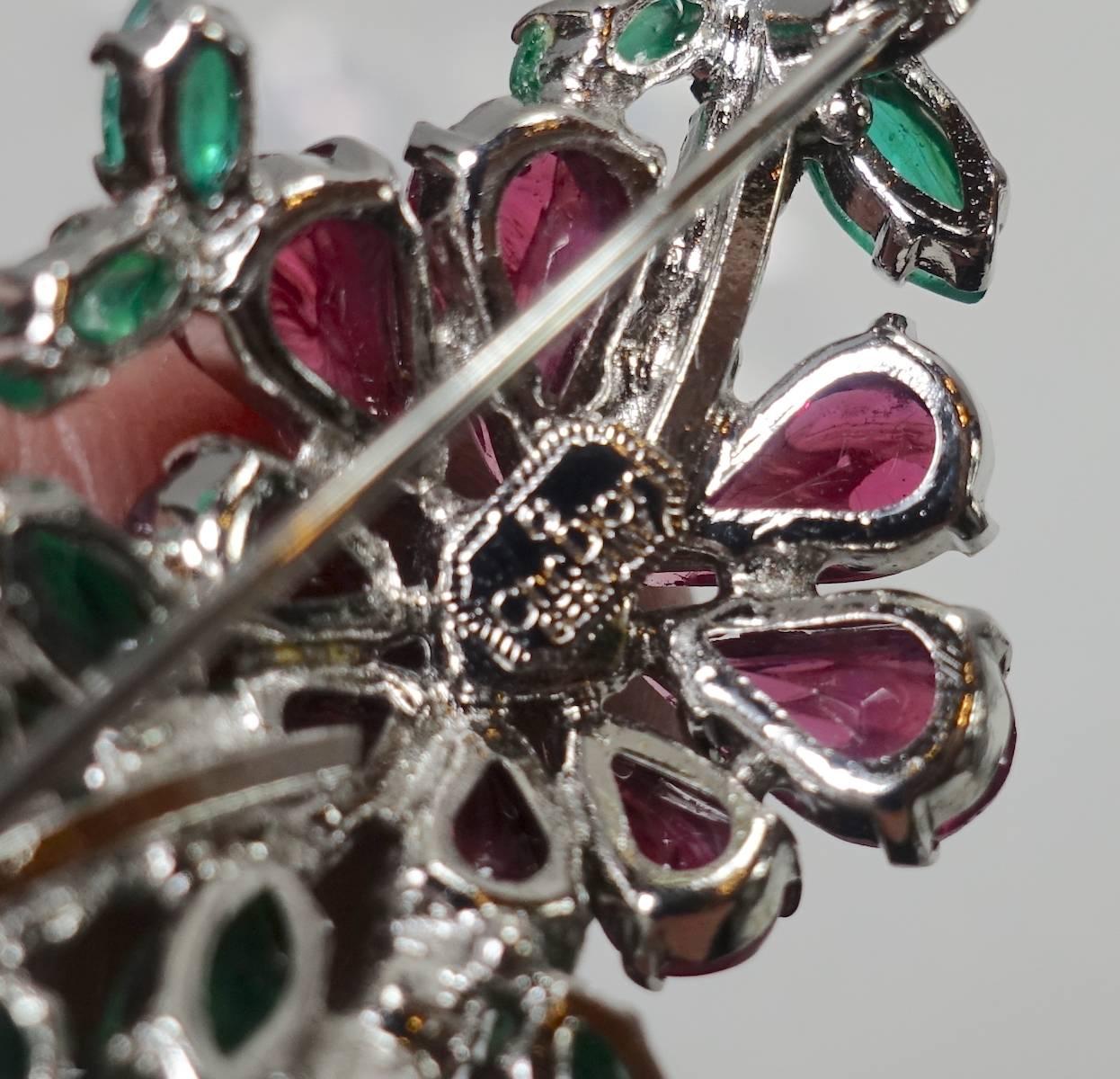 This vintage signed Christian Dior brooch features multi-color rhinestones in a rhodium setting.  This brooch measures 2-1/8” x 1”, is signed “Chr Dior Germany” and is in excellent condition.