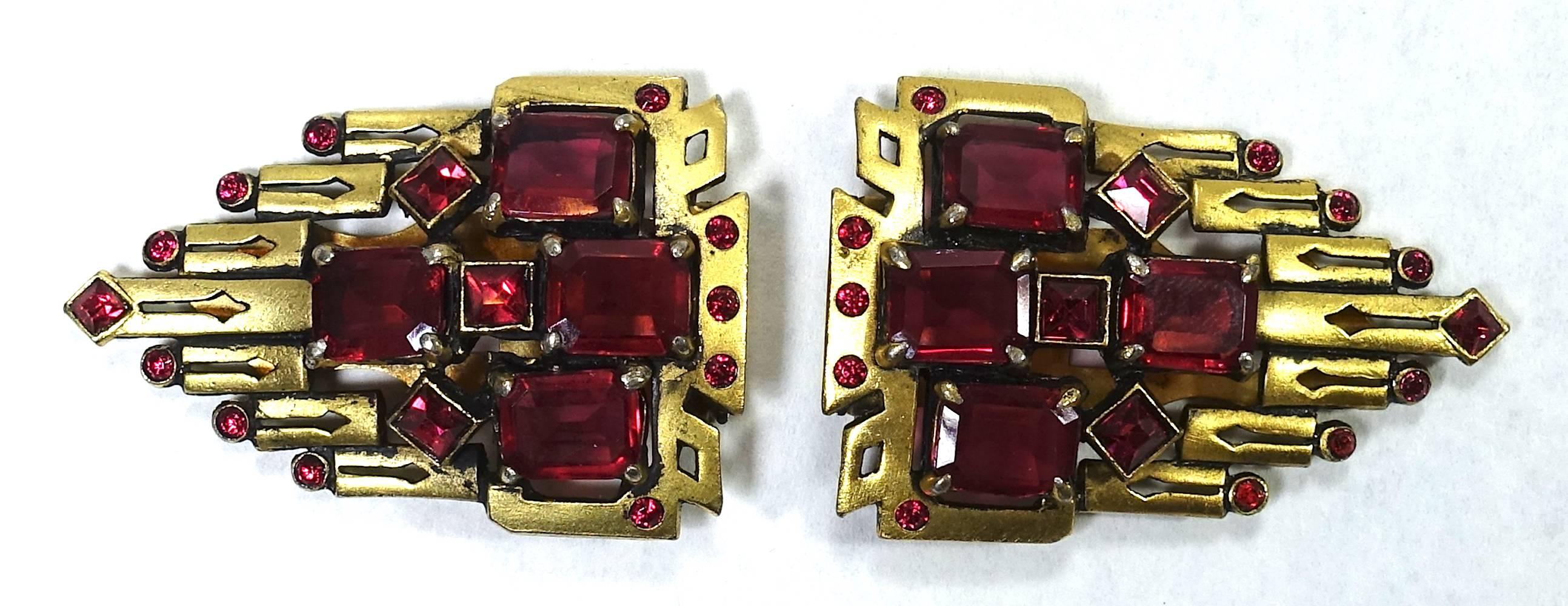 It was love at first site when I saw these fur clips. It is not often you see vintage Art Deco fur clips with not only a beauty Deco design but in such great condition.  They have a triangular shape with red rhinestones in a gold plated setting.