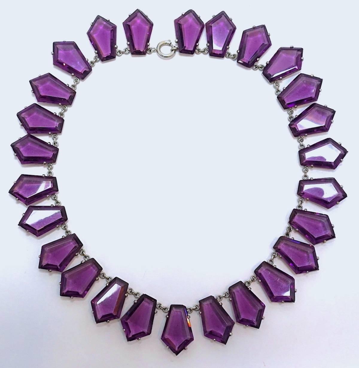I love old Czech necklaces, especially when they come out of a collection like new.  This is extraordinary.  It has 26 chrystal faux amethyst drops all prong set with the old turn catch.  Each drop is 1”x 1/2