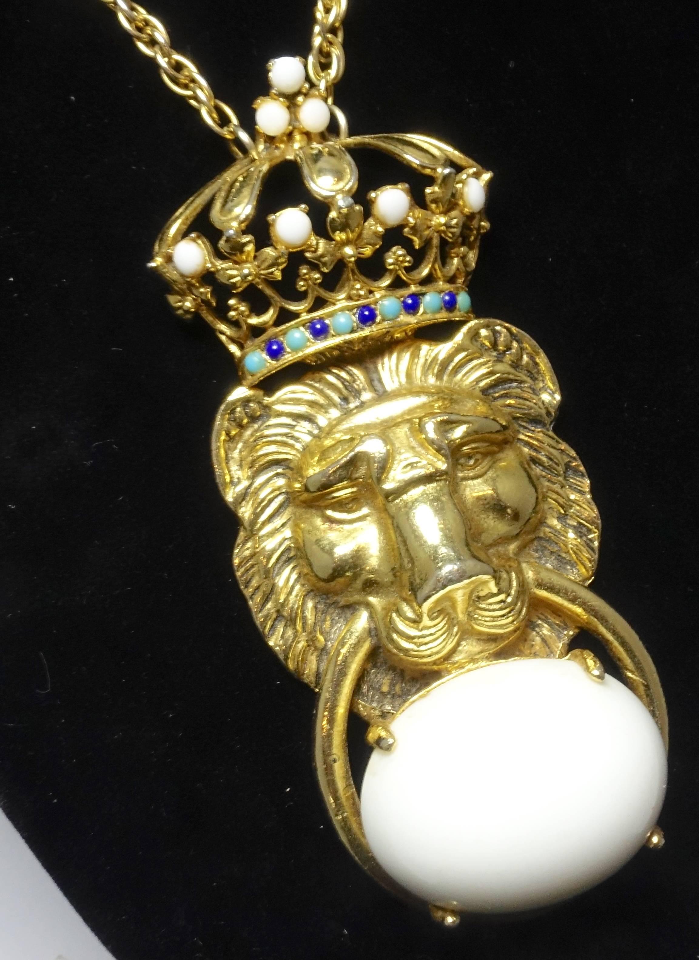 This lion necklace by Pauline Rader lets you know he is the king of the jungle and why she is so collectible today.  He has a crown on top of his head with accents of faux turquoise and faux sapphire beads.  The crown has 3 white beads on top and