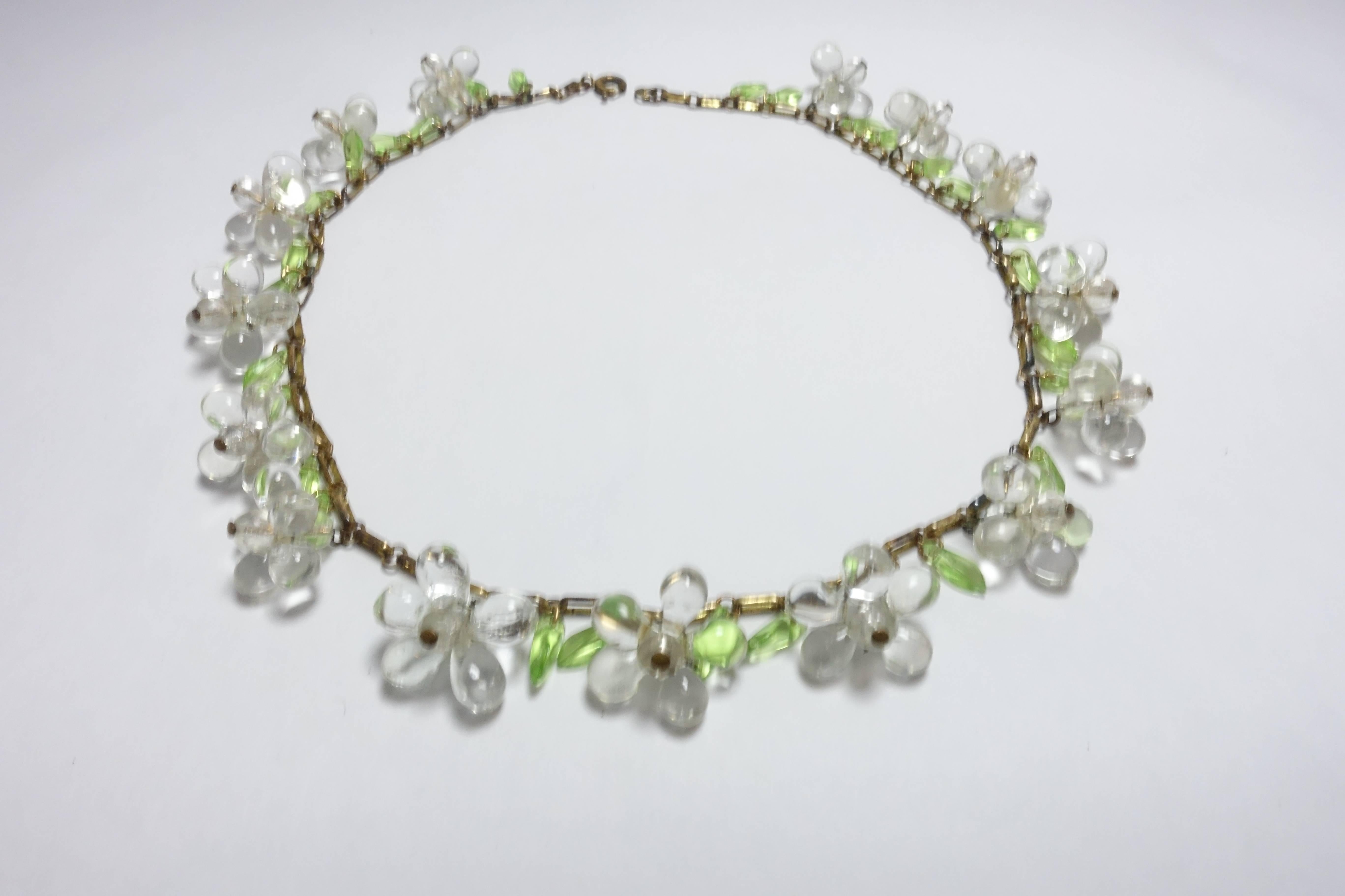 Some people may recognize this necklace as an early Haskell before she signed her jewelry.  It is so beautiful to the eye and to think it survived all these years.  Thank goodness for a careful collector.  The necklace has 15 clear glass flowers