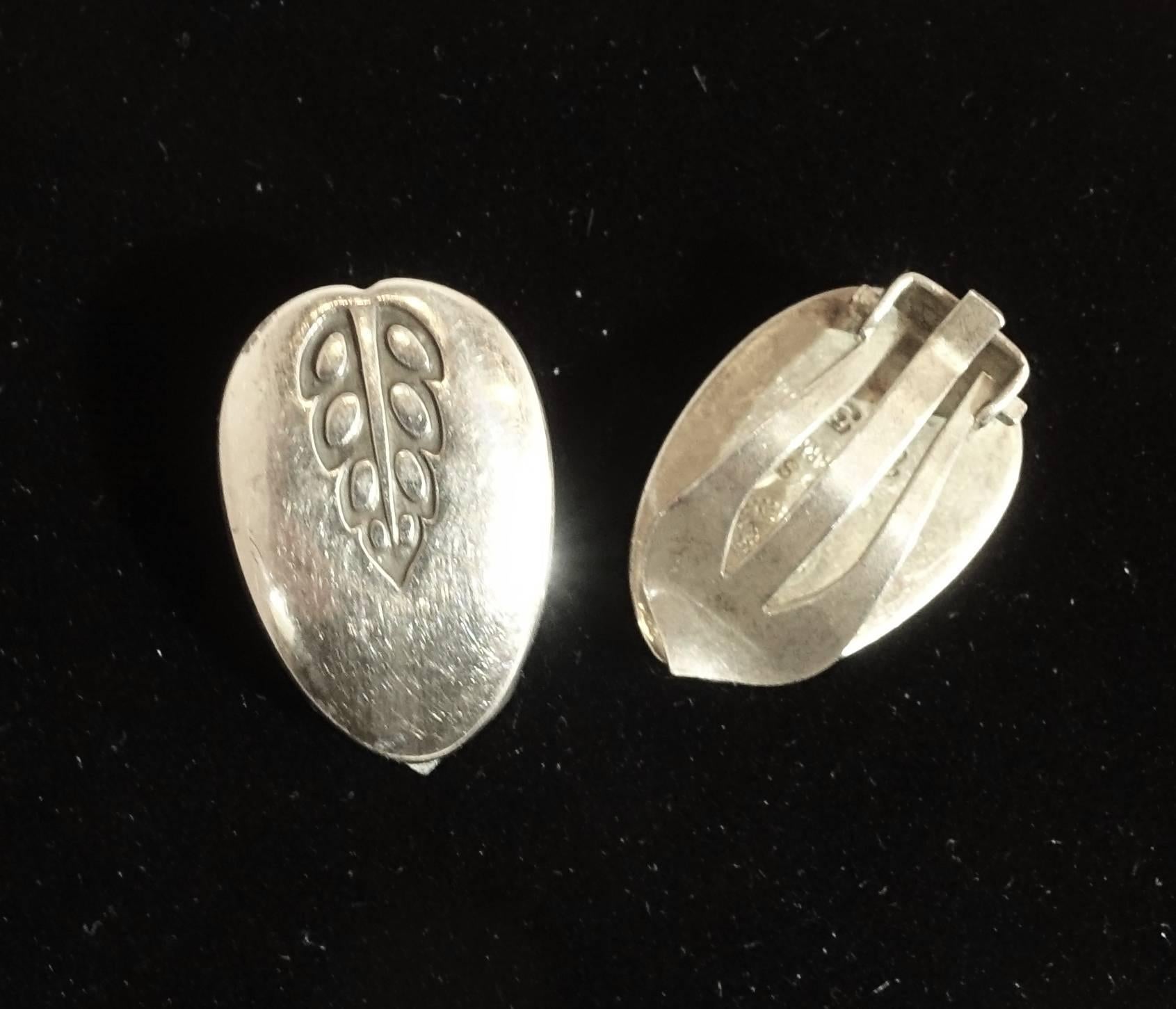These vintage sterling silver Georg Jensen clip back earrings may be delicate looking … but they will compliment your ears just right.  It is simple, yet elegant with a teardrop design with engraved leaves at the top.  They measure 3/4