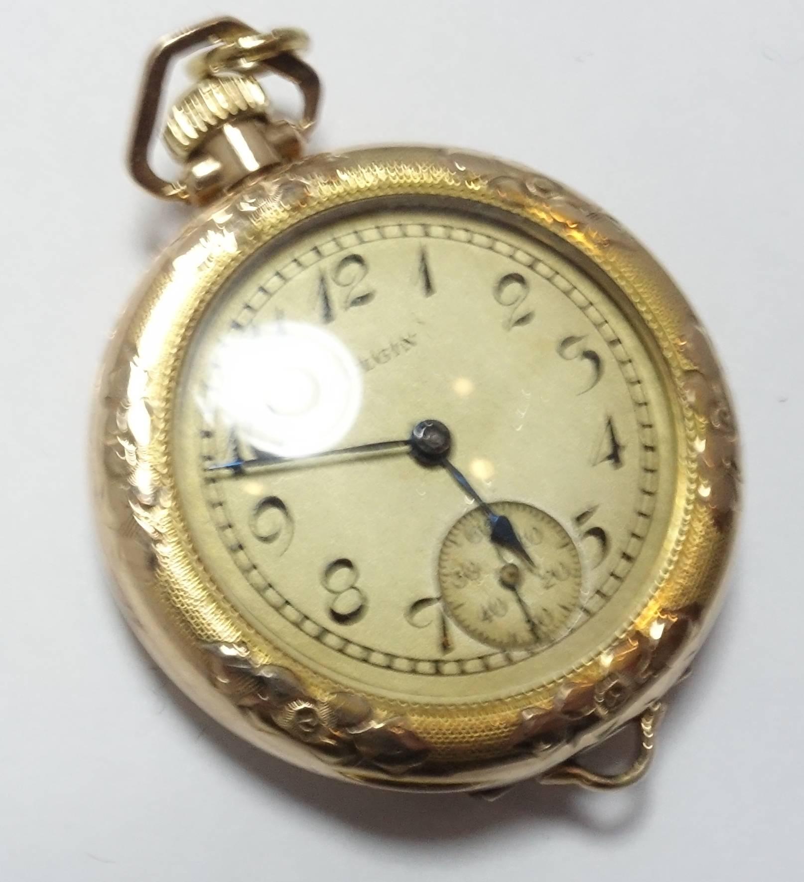When I first saw this watch, I thought it was gold.  But the way gold-filled watches were made in the 1930s and 40s, especially by Elgin, it’s made to look that way.  There are initials on the back that looks like JMG in the old Victorian lettering.