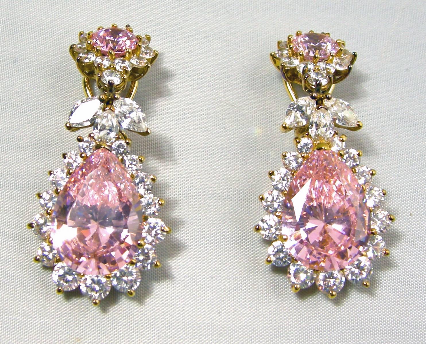 When I first saw these earrings, I thought they were real pink sapphires.  That’s how beautifully designed these clip earrings are.  The top has a round pink faux sapphire surrounded by brilliant crystals.  The top has three marquis shaped crystals