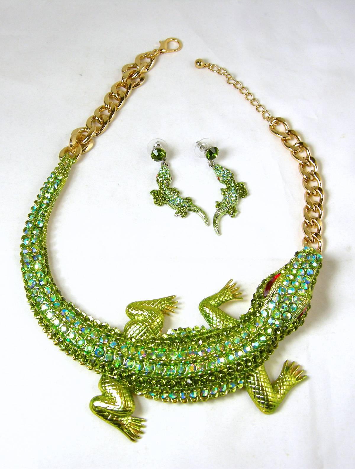 This necklace set will be the center of attention.  The Alligator is encrusted with different shades of green rhinestones as well as green Aurora Borealis to make it glow even more.  Its eyes are red rhinestones and its legs are neon green enamel