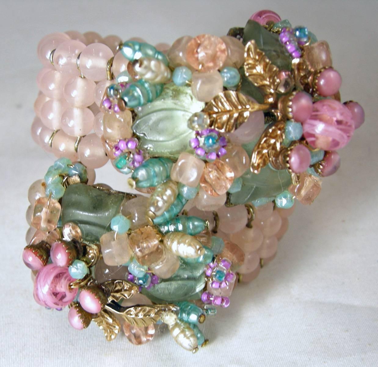 Whenever I come across one of these early Haskell bracelets, I can’t pass it up.  It is from the 1930s when Haskell did not sign … but just looking at it says “Haskell”.  It is wrap bracelet with soft pink glass with gold tone dividers in-between