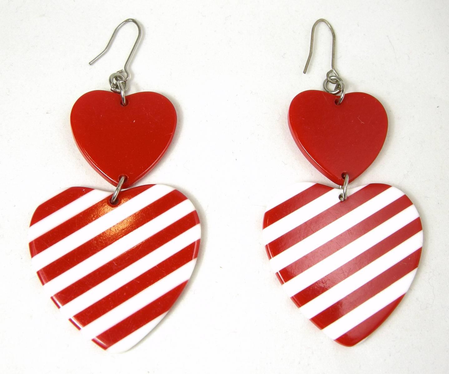 Here are pierced earrings to wear any time you just want to have fun.  The top has the pierced hoop connected to a red enamel heart, which then connects to a larger heart with stripes that looks like a candy cane to me. They measure 2-1/2” long x