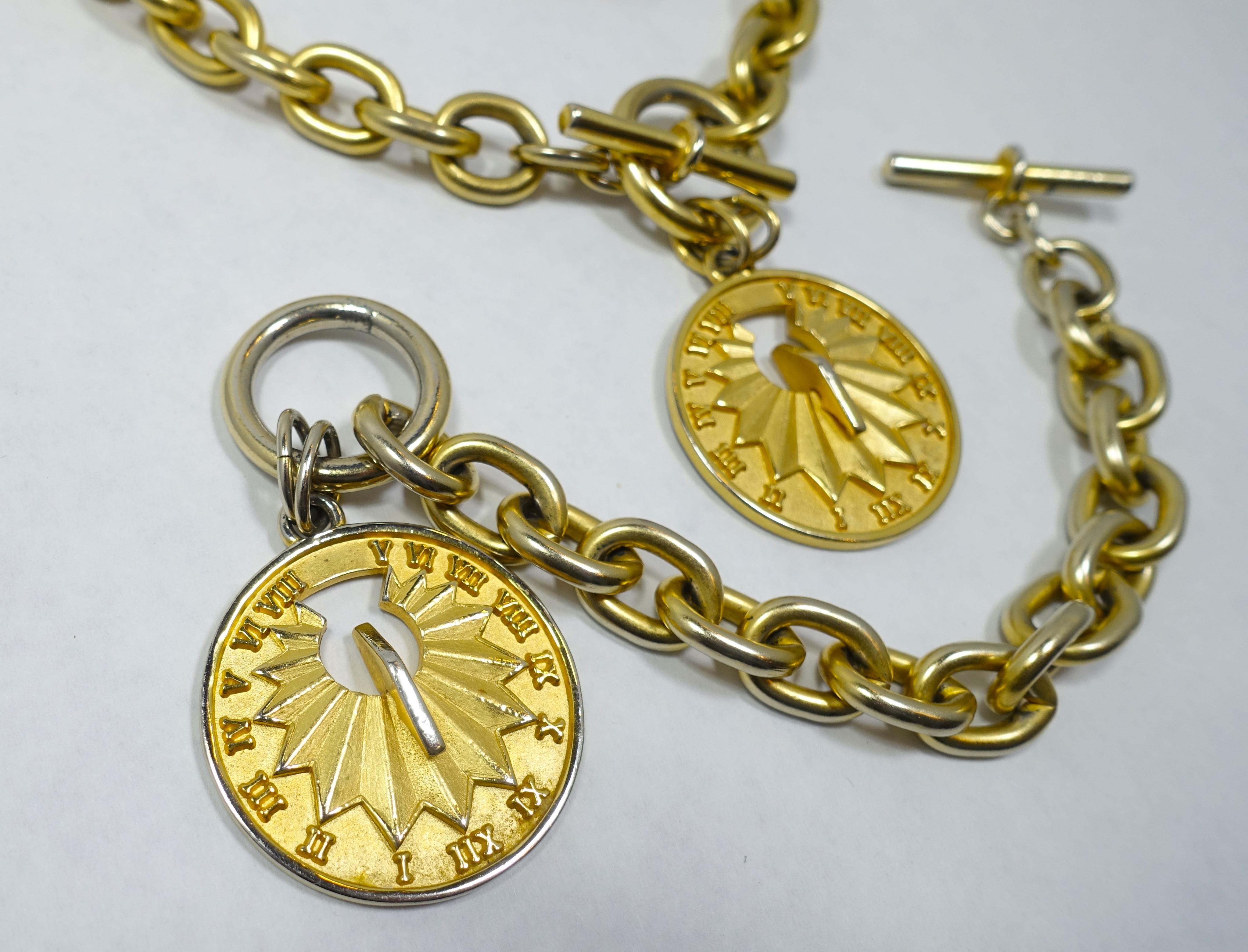 This is a 500 year commemorative Christopher Columbus vintage set designed by Erwin Pearl. It features a drop with a sundial on one side and “Columbus 1492-1992” on the other side … each drop measures 1-1/2” across.  The necklace measures 19-1/2” x