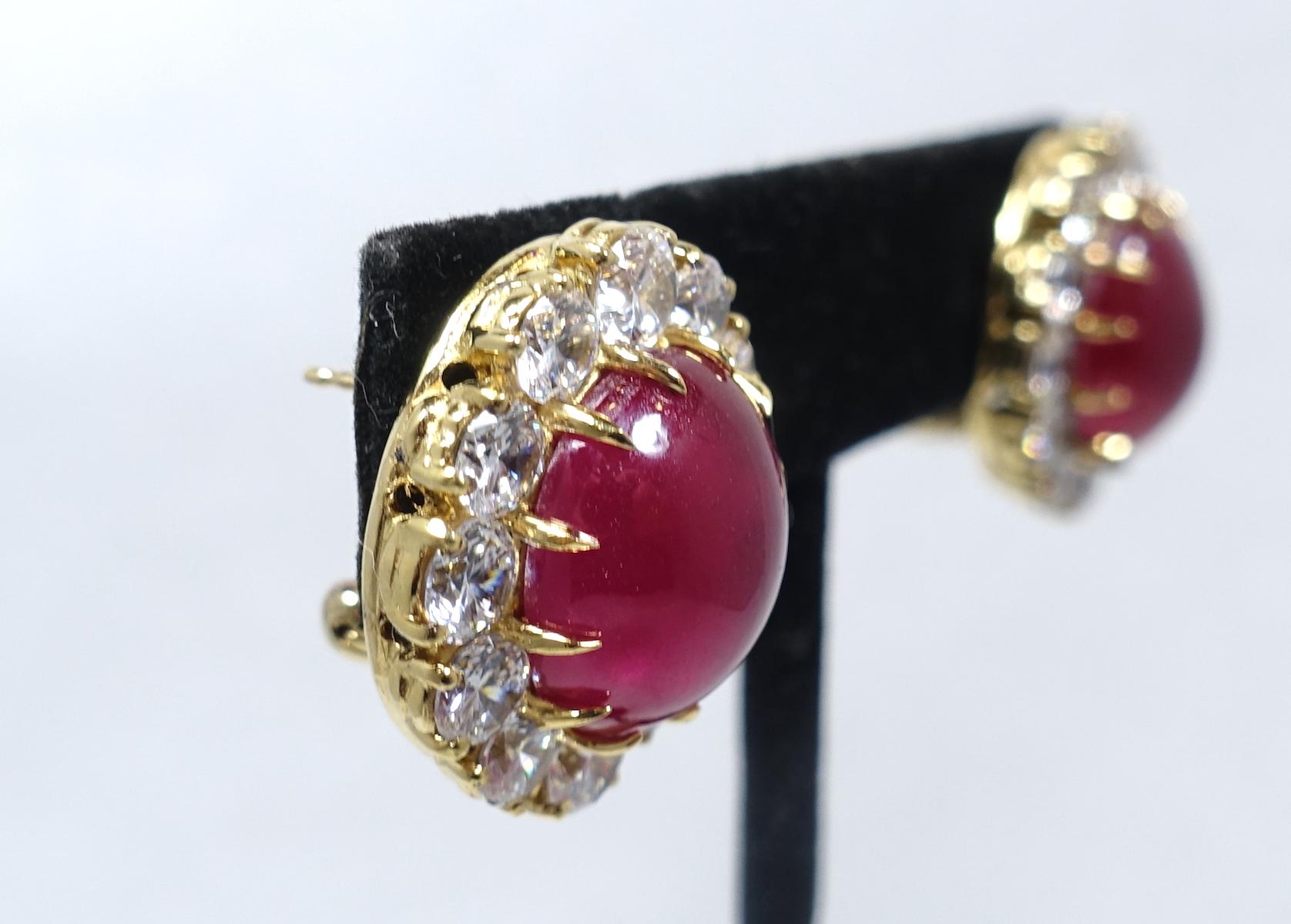 These vintage pierced earrings, although are not signed, have a high quality designer look. The center has red cabochon stones surrounded with brilliant clear crystals in a gold tone setting.  These earrings measure 7/8” x 3/4” and are in excellent
