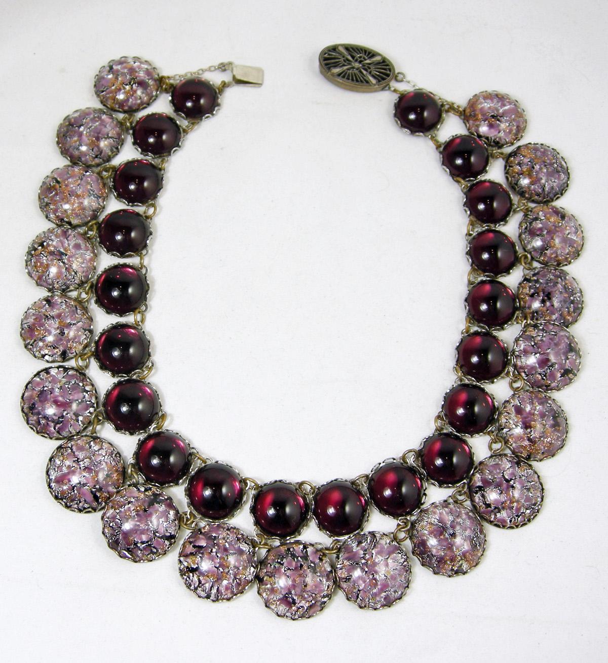 We were fortunate to buy this extremely rare Miriam Haskell necklace from a major collector. It has purple cabochon glass stones and large lavender confetti glass stones that are housed in silver tone cases.  It has an old, oval ornate slide in