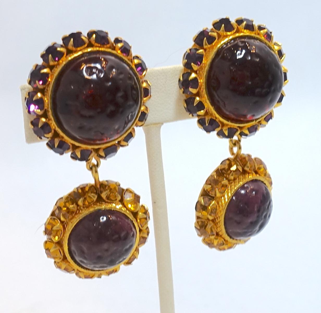 These vintage signed Dominique Aurientis Paris earrings feature cranberry and amethyst Gripoix drops with citrine & amethyst crystal accents in a gold tone setting.  These clip earrings measure 2-1/4” x 1-1/4” and are signed “Dominique Aurientis