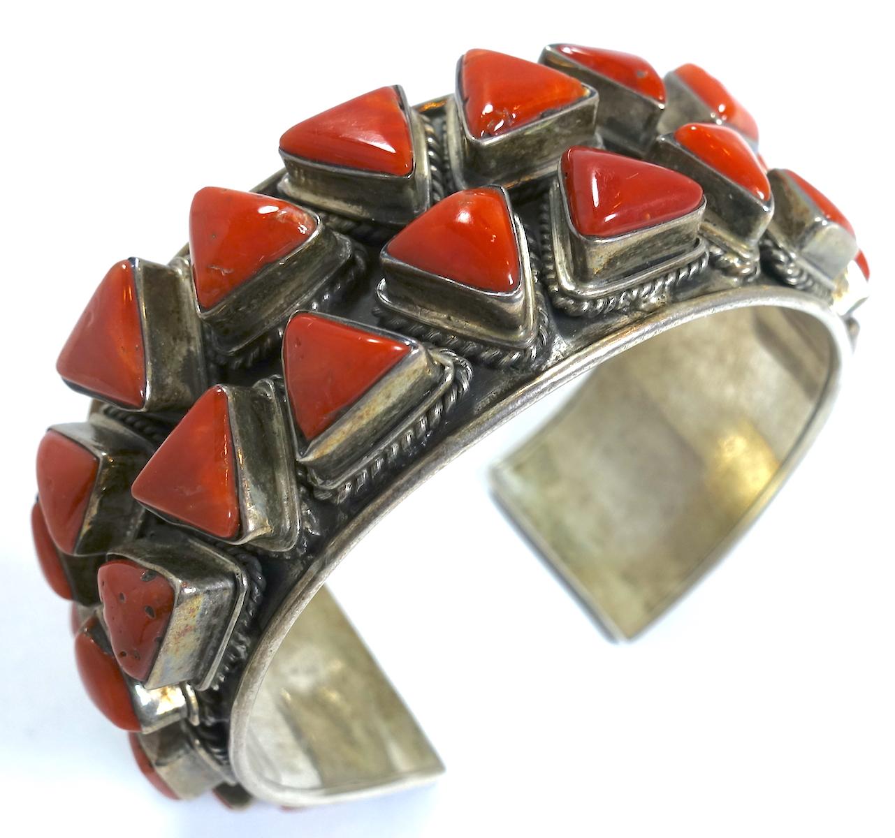 This is a superb example of early Zuni American Indian vintage Pawn cuff bracelet with blood coral stones in sterling silver.  This piece measures 7” x 1-1/8” and is in excellent condition.