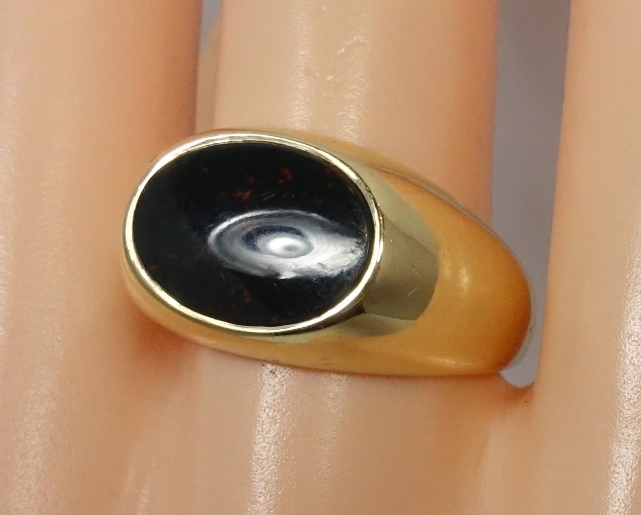This vintage signed Tiffany ring features an oval cut bloodstone in a 14kt gold setting.  It’s a size 9 and measures 1/2” across the top.  It is signed “Tiffany & Co.” and is in excellent condition.