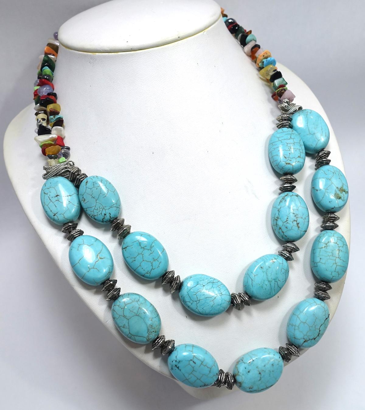 This vintage necklace features faux turquoise and multi-color semi-precious stones in a silver-tone setting.  In excellent condition, this necklace measures 19-1/2” long and has a toggle bolt closure.