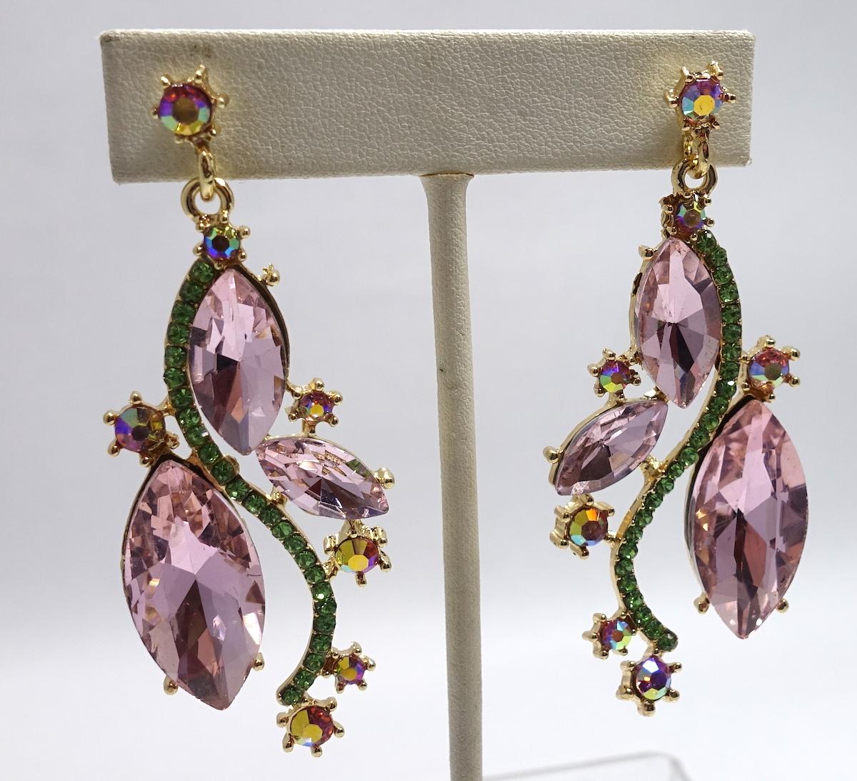 These earrings feature peridot and pink crystals in a gold-tone setting.  These pierce earrings measure 2-3/4” x 1-1/8” and are in excellent condition.