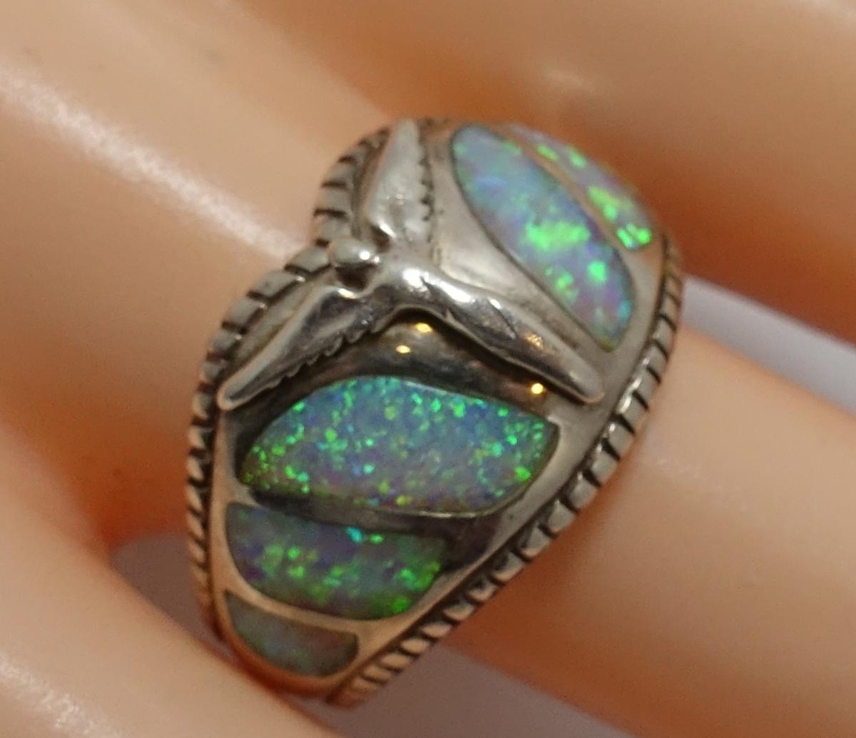 This vintage signed Lavaggi ring features an angel with wings with opal stones in a sterling silver setting.  A size 9, this ring measures ½” wide, is signed “Lavaggi” and is in excellent condition.