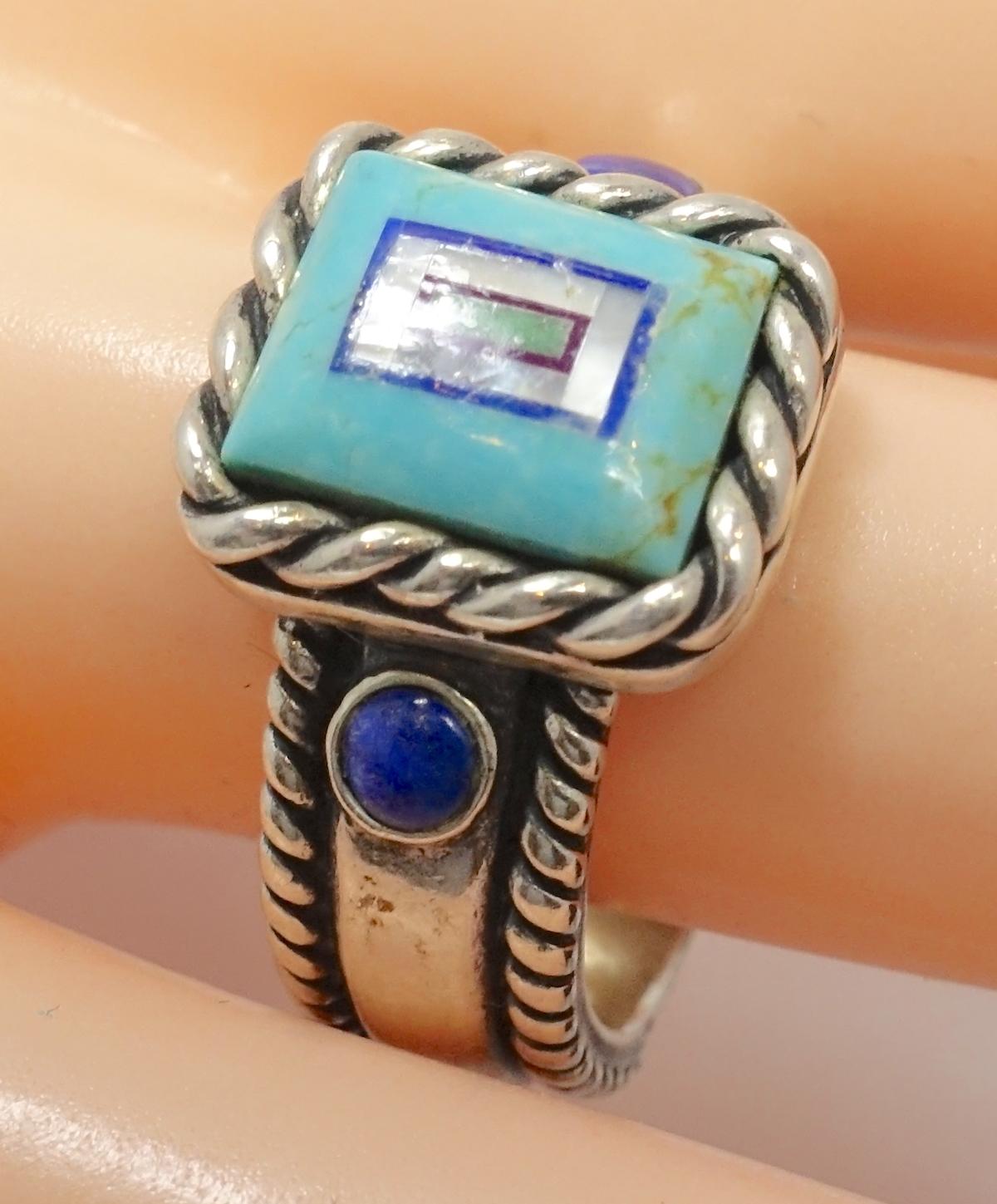 This vintage signed CQS ring features turquoise, lapis and mother of pearl in a sterling silver setting.  A size 9, this ring measures ½ at the top, is signed “CQS Sterl” and is in excellent condition.