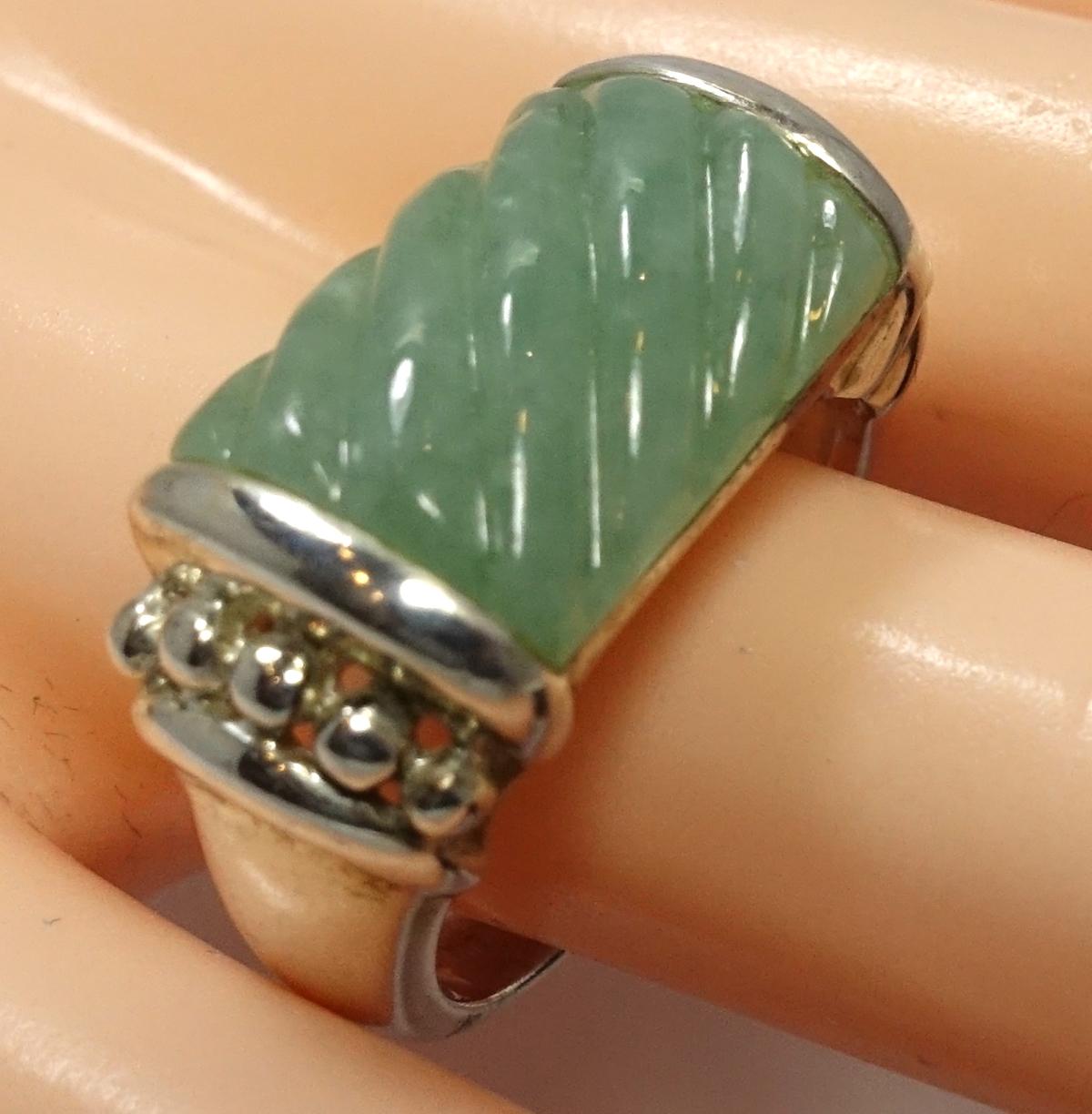 This signed Judith Ripka ring feature poured jade stone in a sterling silver setting.  A size 10, this ring measures ½” wide, is signed “Judith Ripka” and is in excellent condition