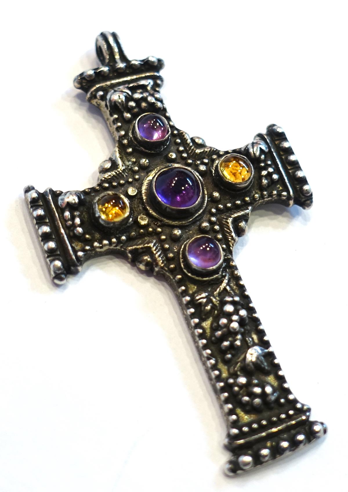 This vintage signed R. Collins cross pendant has an intricate carved design with cabochon cut amethyst and amber stones in a sterling silver setting.  This pendant measures 2-1/2” x 1-3/8” and is signed “R. Collins 91”.  It is in excellent condition.