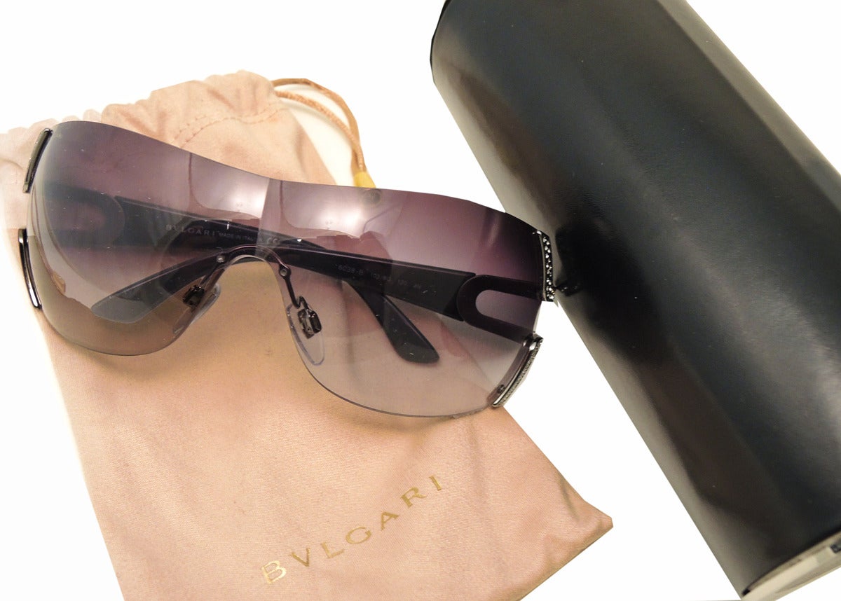 These Bulgari sunglasses feature the Serpenti Special Edition design with Bulgari crystal accents.  In excellent condition, these sunglasses measure 2” top to bottom and come with the original box, pouch and cleaning cloth.