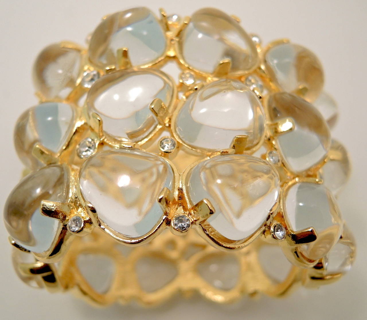 Several years ago when these bracelets were created I bought as many as I could find. Lucky me I found a few great bracelets this month. This signed Kenneth J. Lane bracelet cabochon cut clear resin stones with clear rhinestone accents in a