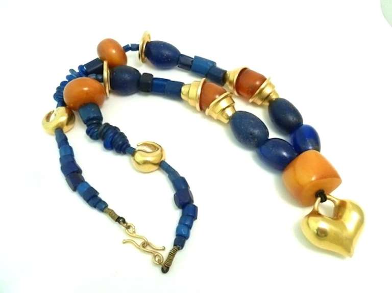 One of my customers bought this directly from Robert Lee Morris and I have been after if for years. This vintage Robert Lee Morris necklace features amber and lapis in a gold-tone setting. In excellent condition, this Robert Lee Morris necklace