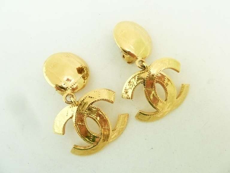 These vintage signed Chanel earrings features the famous CC logo in a gold-tone setting.  In excellent condition, these clip earrings measure 2 1/8” x 1 3/8” and are signed Chanel 94P Made in France.