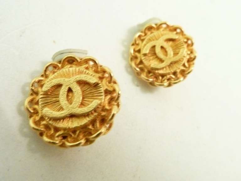 These vintage signed Chanel earrings feature the famous CC logo in a gold-tone setting.   In excellent condition, these clip earrings measure 5/8” in diameter and are signed Chanel 95A Made in France.