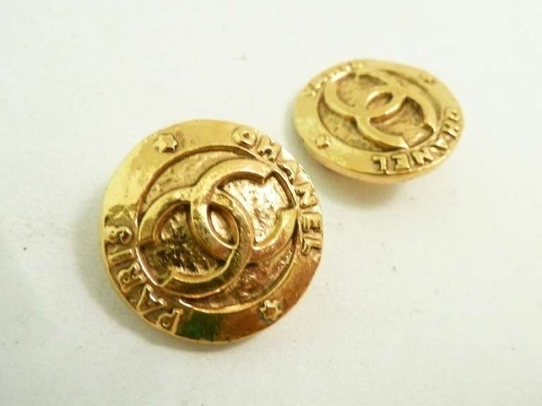 These vintage signed Chanel earrings features the CC logo in a gold-tone setting.  In excellent condition, these clip earrings measure 7/8” in diameter and are signed Chanel Made in France.