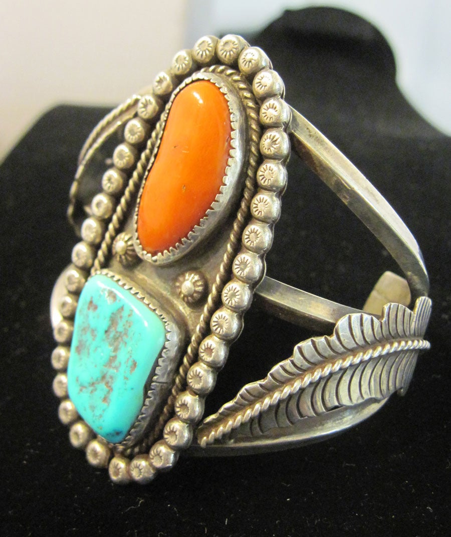 I’m always looking for old pawn pieces, so I was thrilled when I found this fabulous American Indian early pawn cuff bracelet with turquoise & coral stones in a heavily carved sterling silver setting. In excellent condition, this cuff bracelet