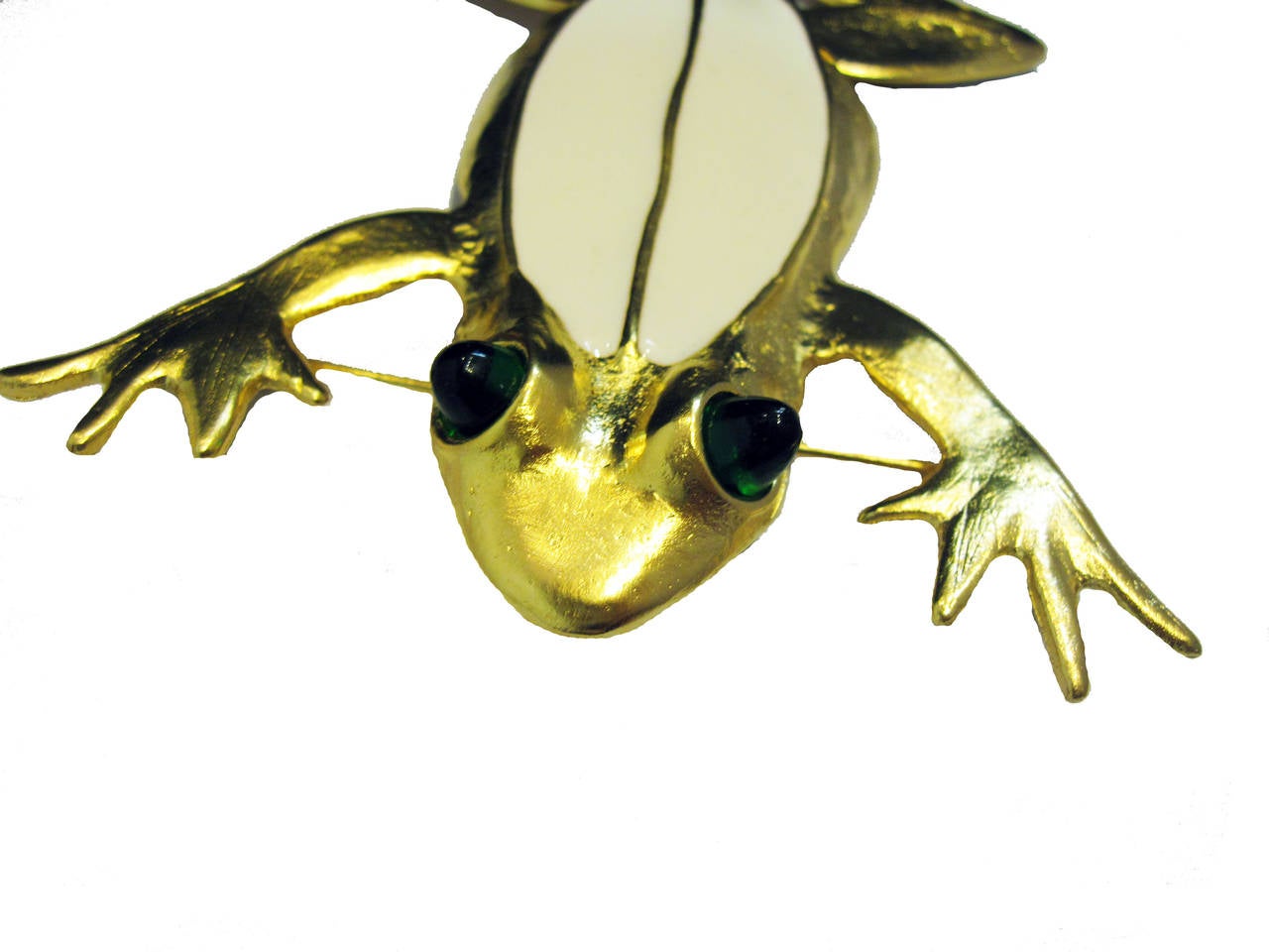 This frog is articulated and Kenneth feels it belongs on the shoulder so the legs hang on the other side. I wore it in the middle of my blouse and it sure got a lot of attention. This is a large white enameled frog pin in a light gold colored metal