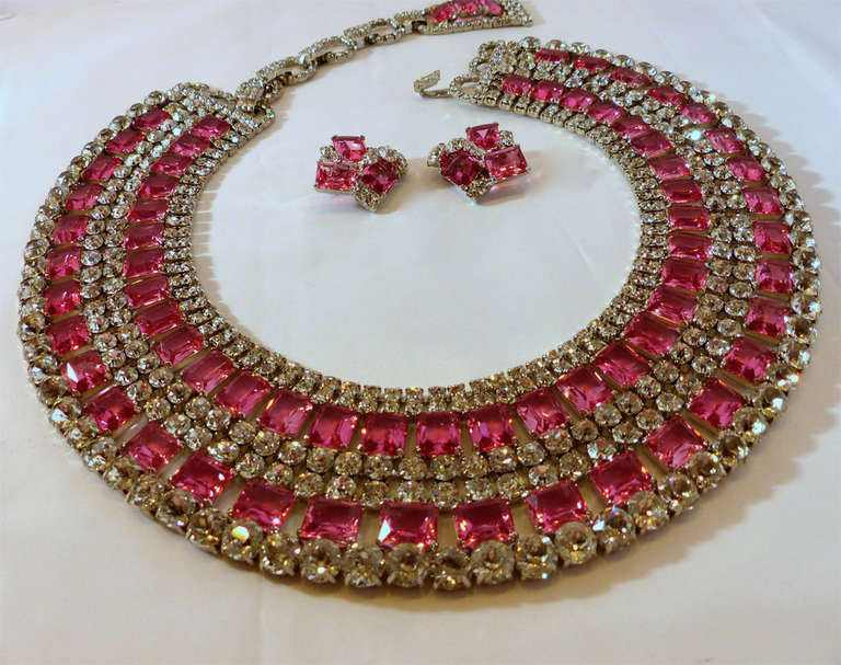 This is a Robert Sorrell creation ... one of a kind.  There are 5 rows in a Cleopatra style bib. The emerald shaped pink crystals are vintage and double pronged on each corner to make sure it's secure.  The clear, brilliant crystals are Swarovski