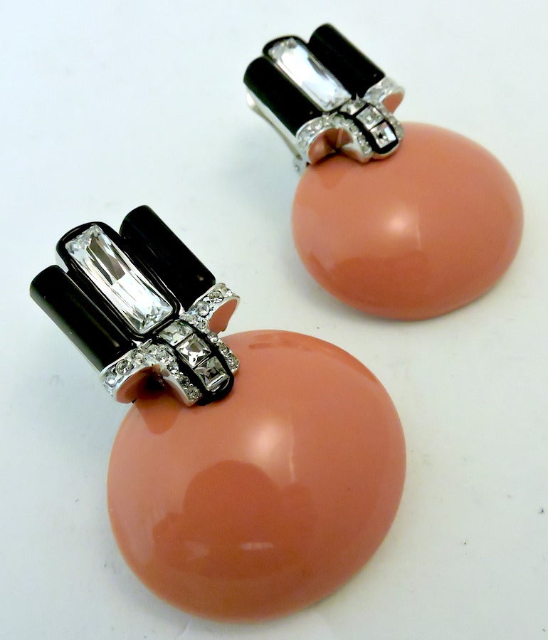 I saw them and I had to have them.  They are very special.  These Kenneth J. Lane deco styled earrings feature faux coral and onyx with clear rhinestone accents in a silver-tone setting.  These clip earrings measure 2” x 1 ½”, are signed “KJL” and