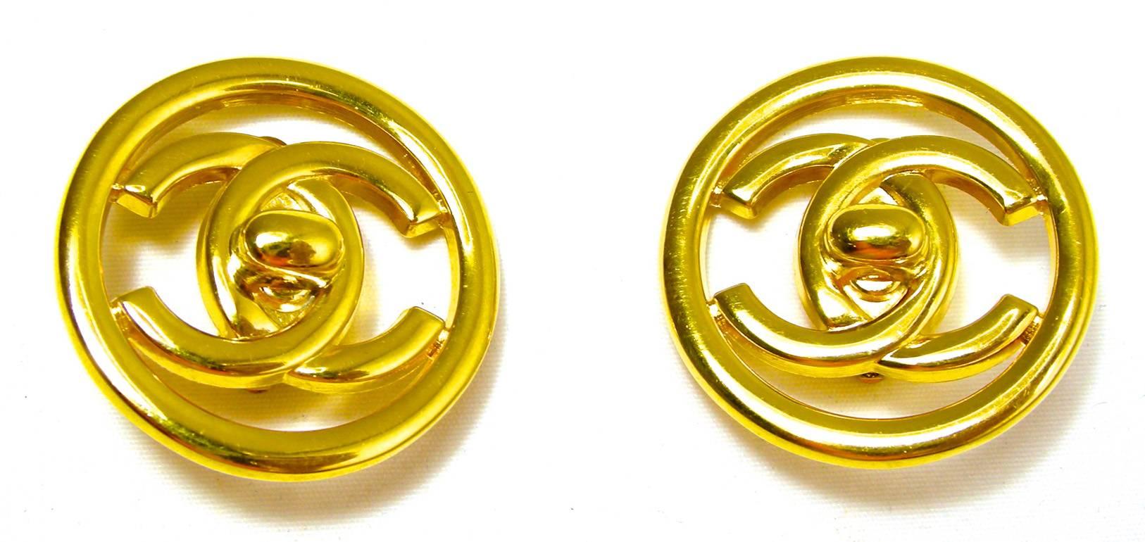 These signed vintage Chanel earrings  feature the famous CC logo in a gold-tone setting.  These clip earrings measure 1-1/4” in diameter and are signed “Chanel 97P Made in France”. They are in excellent condition. 
