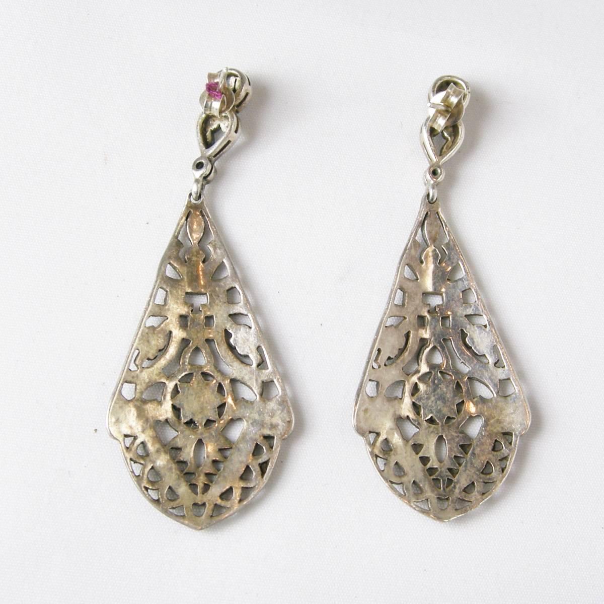 These stunning Art Deco earrings feature marcasites in a sterling silver setting.  These pierced earrings measure 2-1/4” x 3/4” and are in excellent condition.
