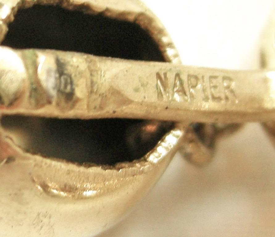 These vintage signed Napier earrings feature a soft chain swag design in a gold-tone metal setting. These clip earrings measure 2-1/4” x 2” and are signed “Napier”. They are in excellent condition.
