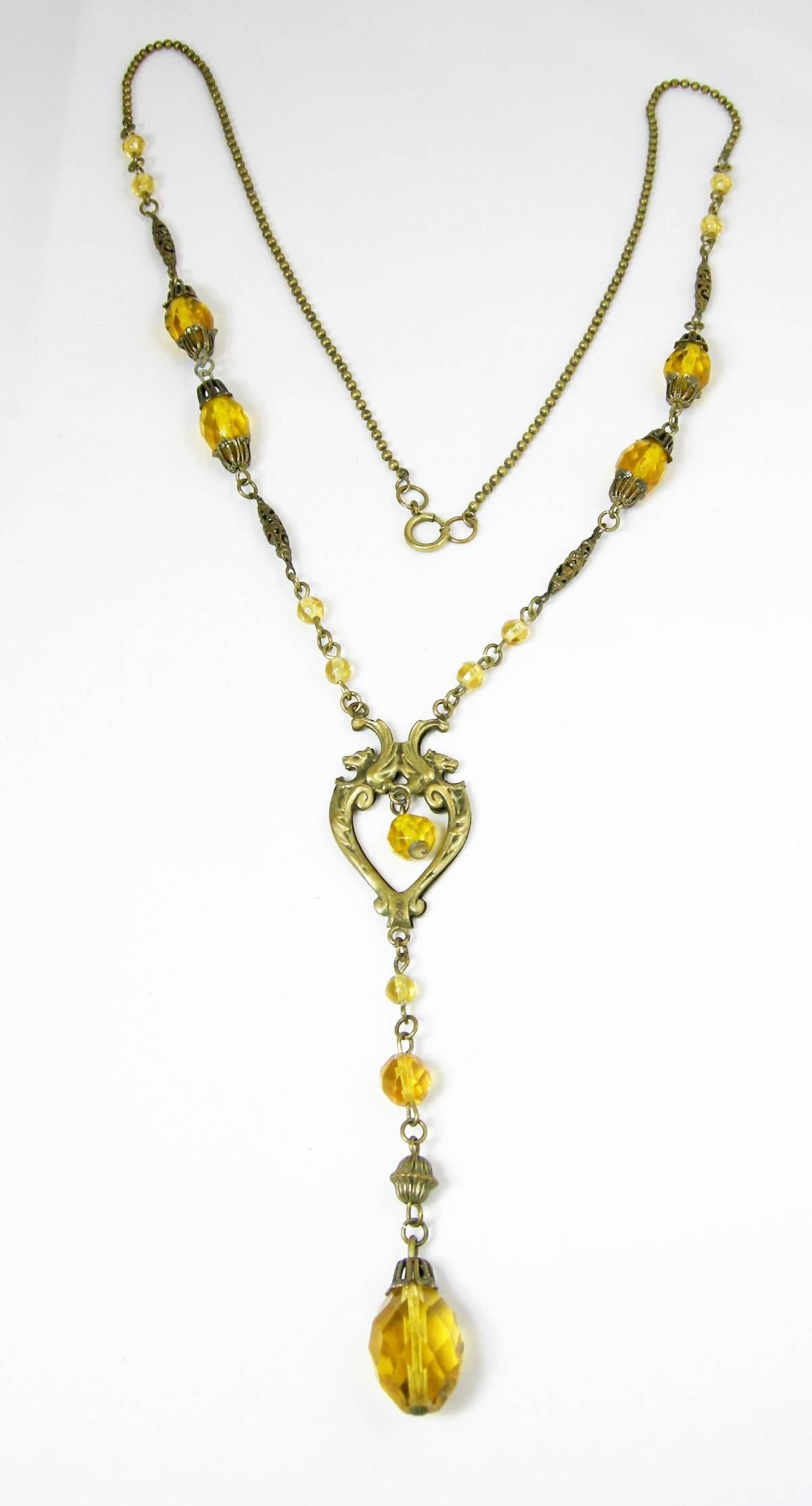 Some Czech pieces are so feminine that you have to stop and examine them.   This is a stunning, and very elegant necklace.  This vintage Czech necklace features citrine color glass beads in a gold-tone setting. The necklace measures 30” with a