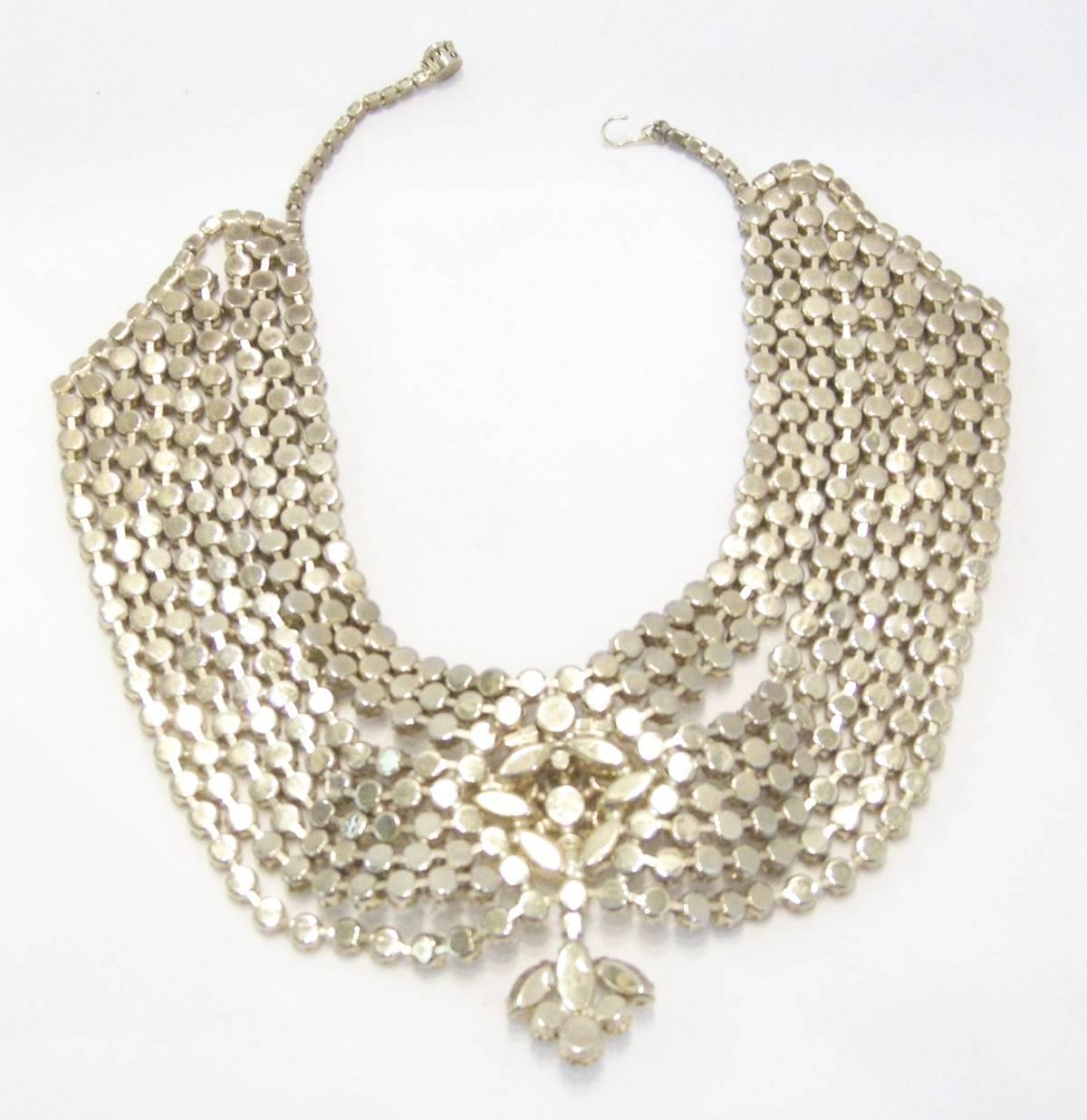 Once in a while I come across something so magnificent I can’t refuse it.  That’s this gorgeous rhinestone bib necklace from the 50s. It looks like it was made for and worn by royalty.  The necklace has 3 rows of rhinestones and then 6 more rows of