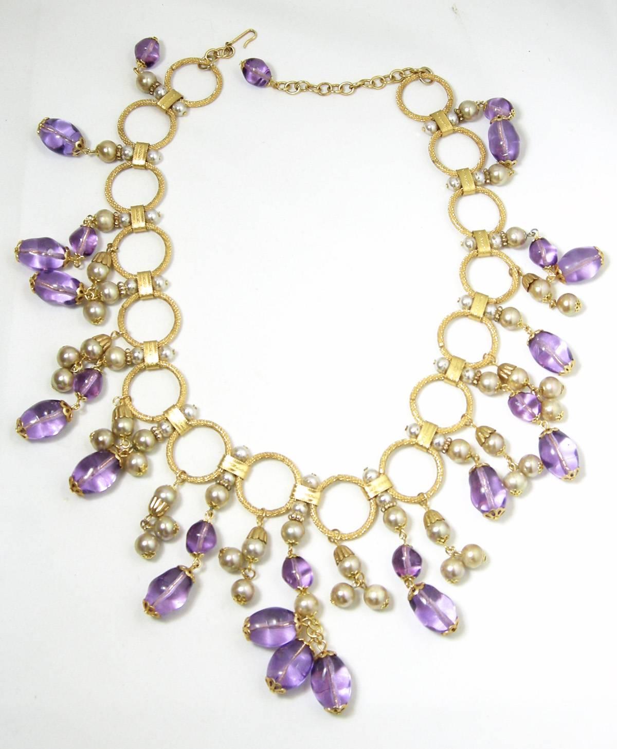 There was a great time in the 50s when wonderful necklaces filled our low cut clothing and created a wow sensation and this necklace still has plenty of wow left. The necklace measures 22” with a hook closure and is in great condition.
