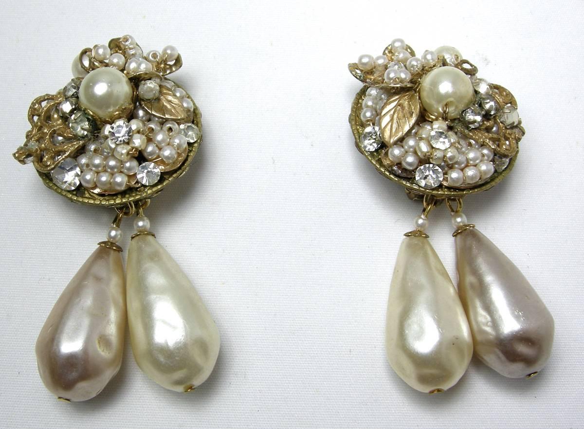 I had to take a second glance at these earrings because I thought they were a pair of Haskell earrings. I was equally delighted with the quality of DeMario’s workmanship. This pair of 1950s vintage earrings feature 2 baroque pearls dangling with
