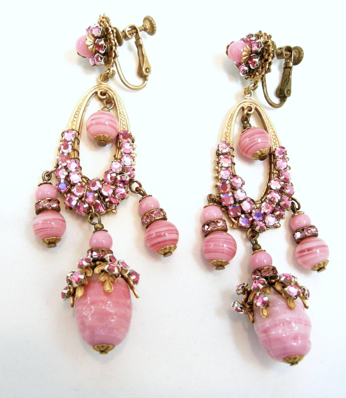 These magnificent Haskell earrings are so rare to find in such fantastic condition. Haskell was famous for her intricately designed jewelry and these earrings are a perfect example. They are long duster earrings with French molded pink glass