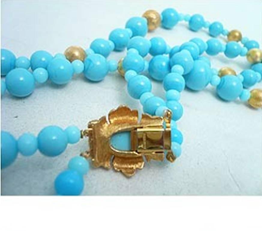 This vintage signed Joseph Mazer necklace has faux turquoise and gold beads. This 2-strand necklace measures, on the inside strand, 18”; a single large bead is 1/2